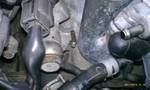 1994 Ford Probe - Detailed view of various engine parts and hoses, likely from a vehicle's engine bay.