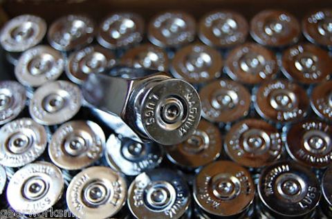 2006 Ford E350 - A collection of spent ammunition casings, including .38 Special and .45 Colt, with a tool visible.