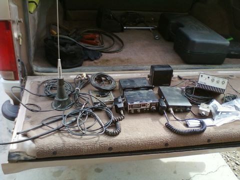 1996 Ford Bronco - Radio equipment is laid out on the tailgate of a 1996 Ford Bronco.