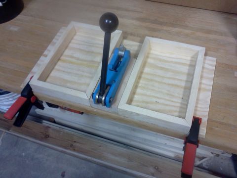 1996 Ford Bronco - A woodworking jig with a blue lever is set up on a table with wooden frames secured by clamps.