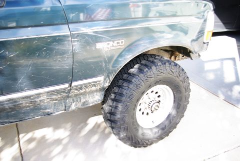 1995 Ford Bronco - This 1995 Ford Bronco has a "Bronco" badge on the fender above a large off-road tire.