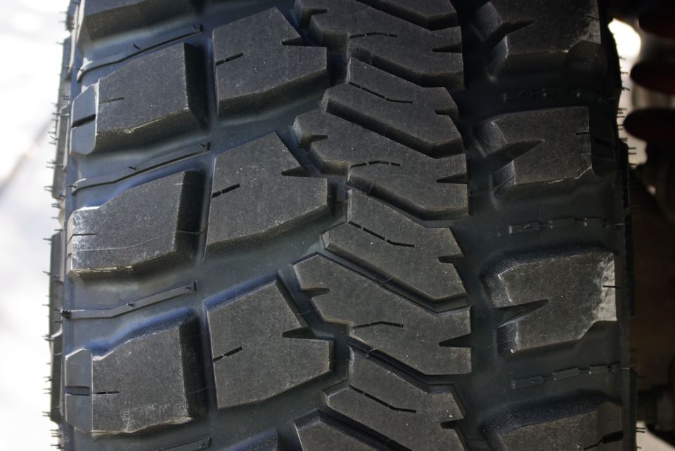 Close-up of aggressive off-road tire tread pattern