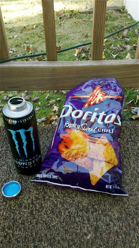 1995 Ford F-150 - A can of Monster Energy and a bag of Doritos sit on a textured surface near a wooden railing.