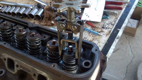 1990 Ford Bronco - spring compressor tool. tighten it down and then pop out valve locks.