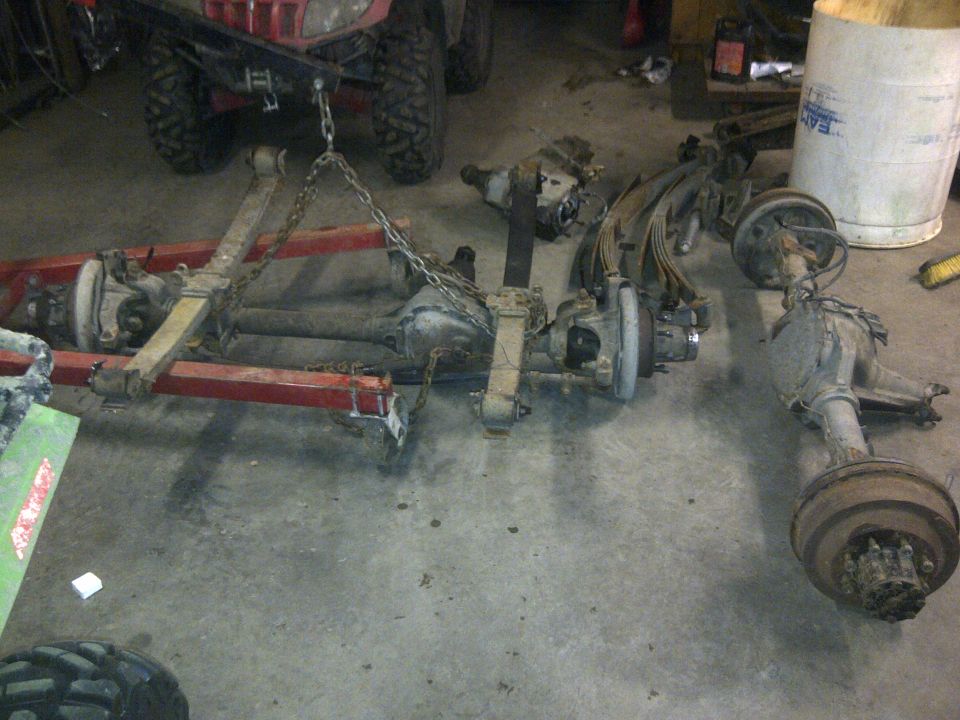 Vehicle axles and suspension parts on an engine hoist