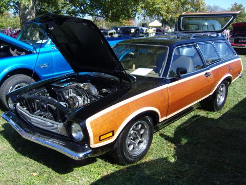 2007 Ford Mustang - This wood-paneled station wagon is displayed with its hood and rear hatch open, revealing the engine and interior.