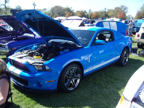 2007 Ford Mustang - A blue 2007 Ford Mustang GT500 is displayed with its hood open at an outdoor event.