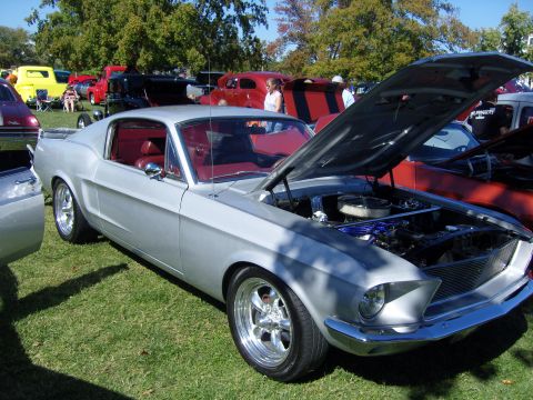 2007 Ford Mustang - Classic 1967 Ford Mustang coupe on display at a car show with its hood up.
