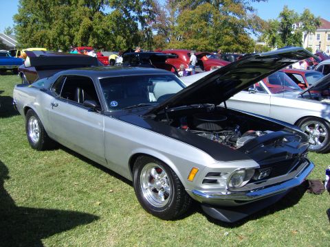 2007 Ford Mustang - A classic 1970 Ford Mustang is displayed with its hood open at an outdoor car show.