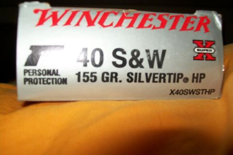 2000 Chevrolet Tahoe - A box of Winchester 40 S&W Super X ammunition is shown, 155 grain Silvertip HP rounds for personal protection.