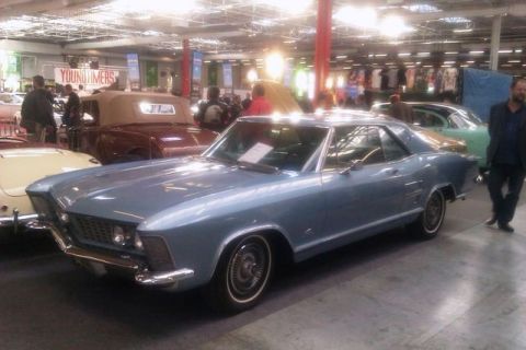 1991 Ford LTD Crown Victoria - A light blue coupe is parked at an indoor car show with other vehicles visible.