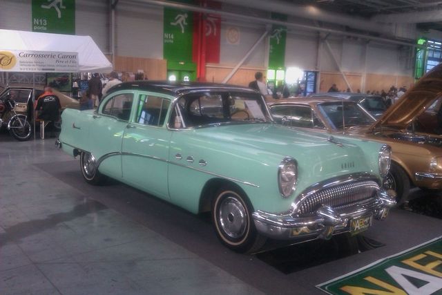 Mint green 1955 Buick sedan with black roof, 3q-front view