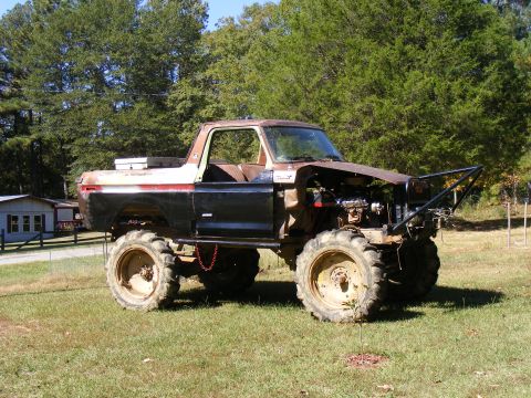 1978 Ford Bronco - This heavily modified 1978 Ford Bronco sits high on large tires with its engine exposed.