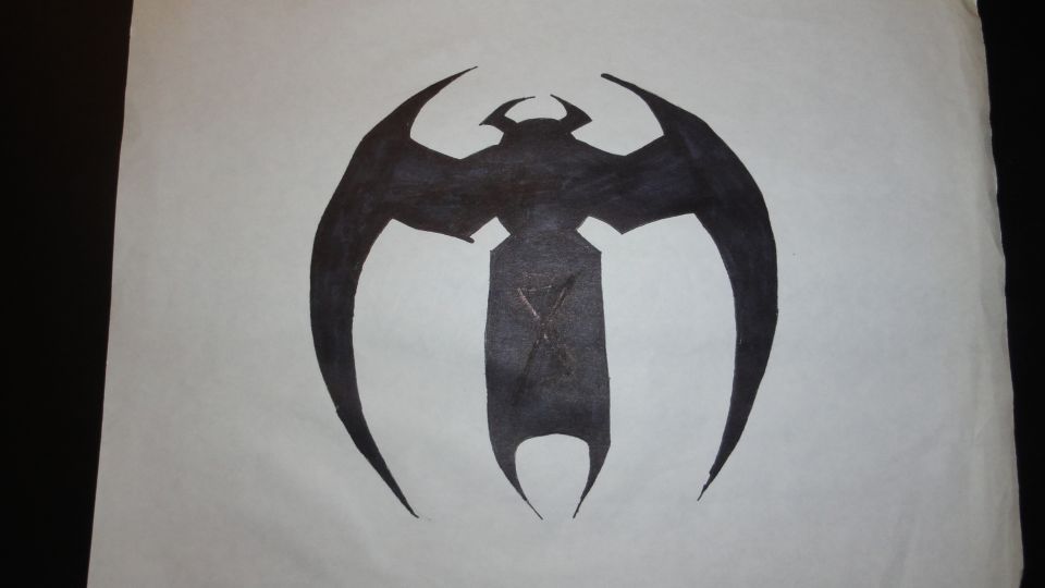 Hand-drawn black winged figure or logo on paper