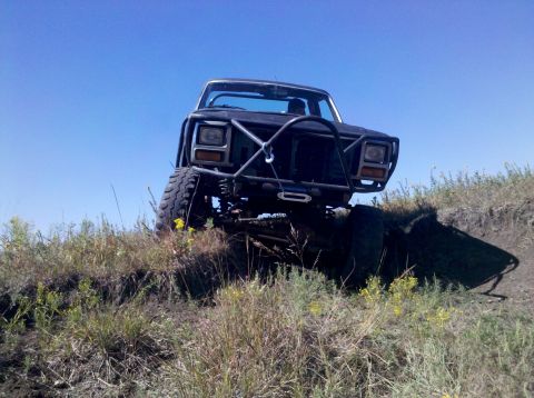 1986 Ford Bronco - This modified SUV is equipped for off-road adventures, a heavy-duty bumper and winch system.