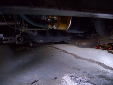 1995 Ford Probe - Underside view of a car, focusing on the oil filter and exhaust system components.