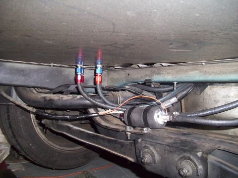 1995 Ford Probe - Custom fuel filter and lines are installed on the underside of a vehicle.