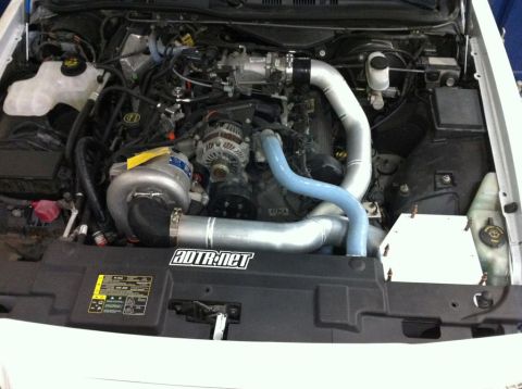 2004 Ford Crown Victoria - Engine bay modifications including a supercharger and custom intake piping are visible.