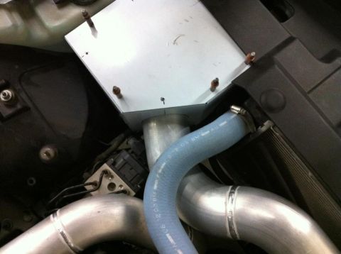 2004 Ford Crown Victoria - Custom intake system with silver box and blue hose installed in an engine bay.