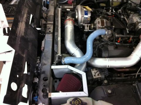 2004 Ford Crown Victoria - Custom turbocharger and intake system installed in an engine bay.