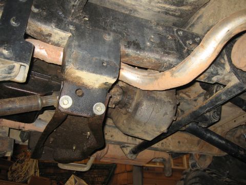 1979 Ford Bronco - A view of the underside of a vehicle, focusing on the drivetrain and exhaust system.