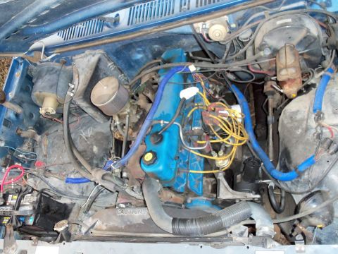 1985 Ford Bronco - Engine bay details showing the motor and associated components.