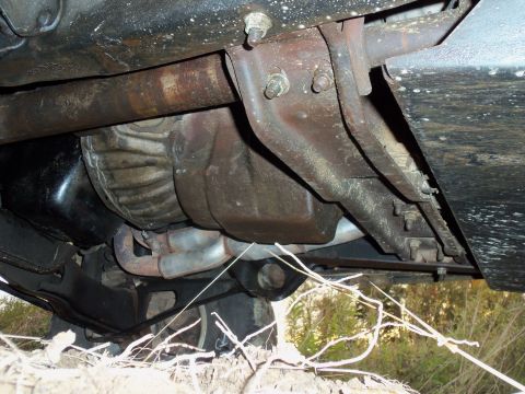 1985 Ford Bronco - A view of the undercarriage of a vehicle, revealing its mechanical components and frame structure.