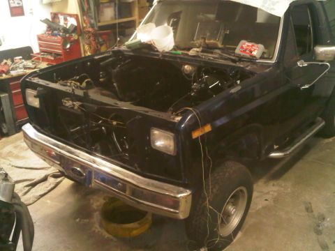 1985 Ford Bronco - This Ford Bronco is undergoing some work, with its engine compartment completely cleared out.