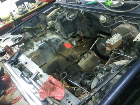 1985 Ford Bronco - Vehicle's engine bay is empty, awaiting a new engine installation.