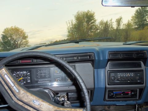 1985 Ford Bronco - Interior view of a 1985 Ford Bronco, the dashboard and steering wheel.