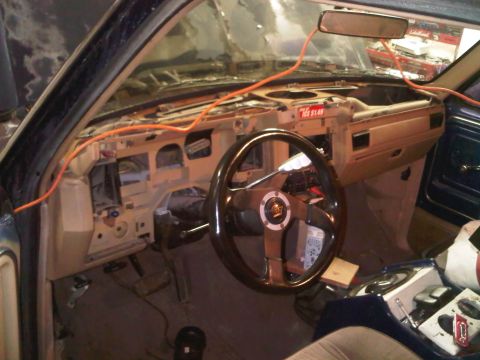 1985 Ford Bronco - Interior of a 1985 Ford Bronco during a repair, showing the dashboard disassembled.