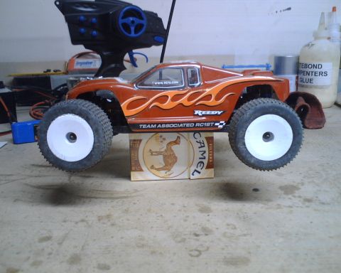 1985 Ford Bronco - This remote control car is branded Team Associated RC18T and has flame decals.