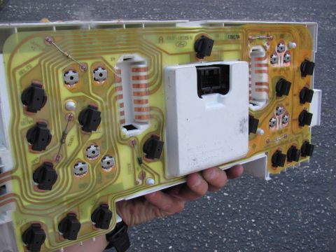 1995 Ford Bronco - Close-up of a Ford Bronco instrument cluster circuit board, showing its internal components and wiring.