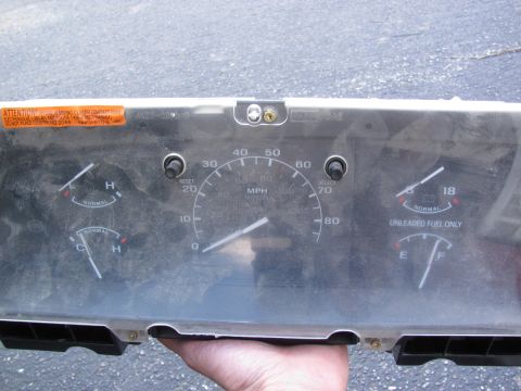 1995 Ford Bronco - Instrument cluster assembly a speedometer, fuel gauge, and temperature gauges, likely for a Ford vehicle.