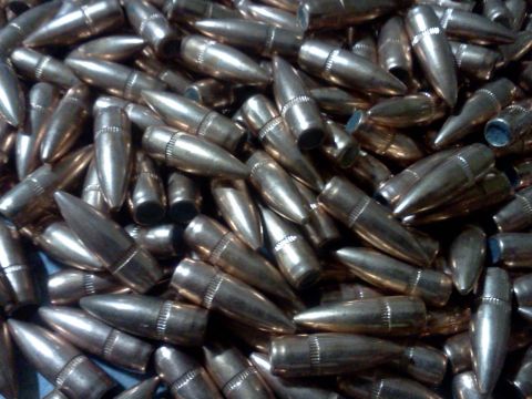 1996 Ford Bronco - A large quantity of bullets are piled together, filling the frame.