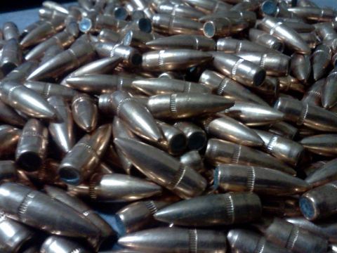 1996 Ford Bronco - A pile of brass-colored bullets is shown, with some text visible at the bottom right.