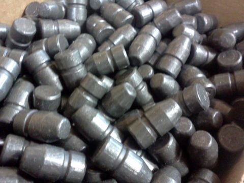 1996 Ford Bronco - A large quantity of metal valve lifters are shown in this image, likely for automotive use.