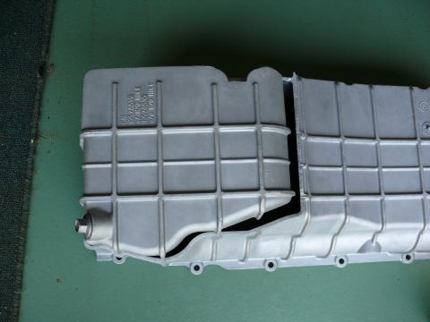 1976 Chevrolet Corvette - This is an aluminum oil pan with visible casting numbers and a drain plug.
