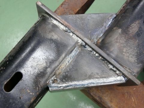 1976 Chevrolet Corvette - This image shows a close-up view of a welded metal frame, likely a part of a vehicle's chassis or suspension system.