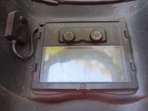 1968 Ford Mustang - Close-up view of a welding helmet, showing its adjustable features and protective lens.