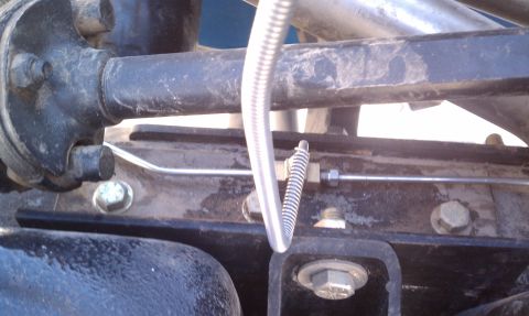 1979 Ford Bronco - Brake line and spring assembly detail, likely from a vehicle's undercarriage.
