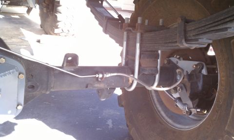 1979 Ford Bronco - This image shows the rear axle, leaf springs, and brake components of a vehicle, not a specific model year.
