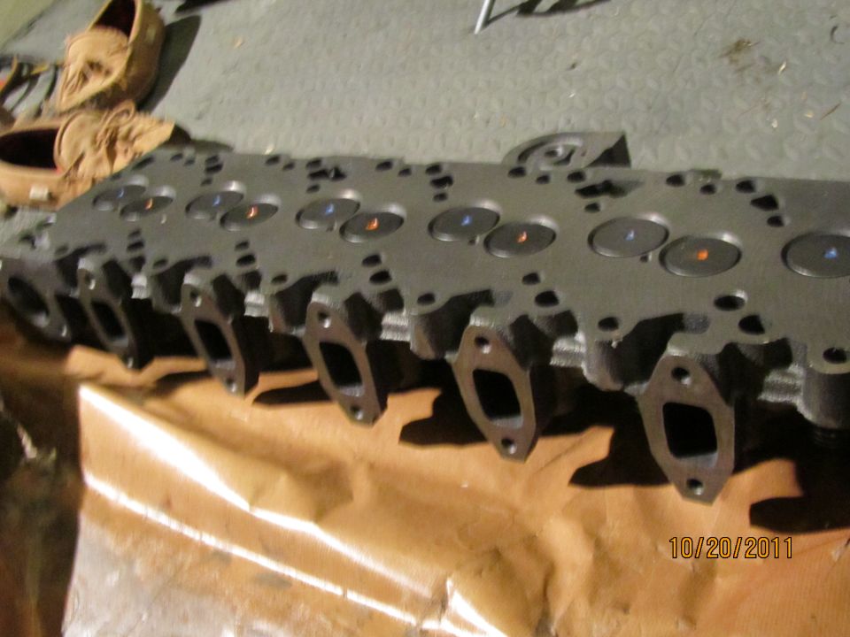 Engine cylinder head with visible valves and exhaust ports