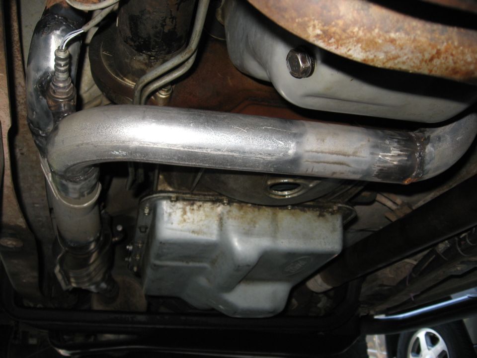 Exhaust pipe and oil pan underside