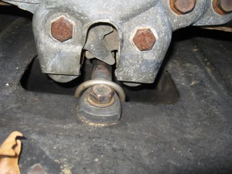 1978 Ford Bronco - A close-up view of a vehicle's suspension system, showing bolts and metal parts.