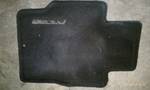 1994 Ford Probe - A black floor mat with the Mazda logo is shown.