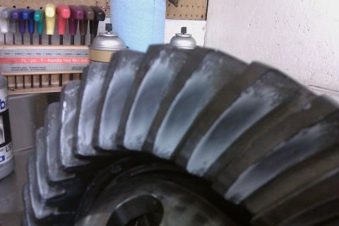 1999 Chevrolet Camaro - A close-up view of a large gear, likely from a vehicle's drivetrain, with white paste applied to its teeth.