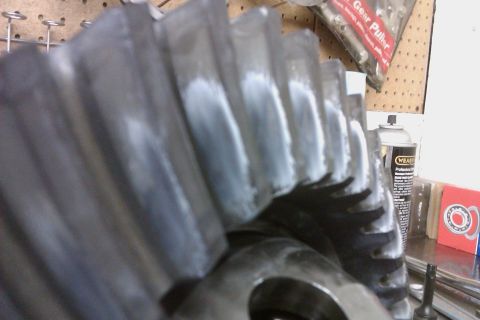 1999 Chevrolet Camaro - A differential gear is shown with white marking compound applied to its teeth, indicating contact points.