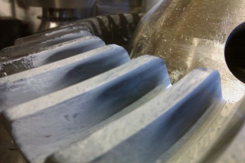 1999 Chevrolet Camaro - A detailed view of metallic gear teeth, showing wear and texture.