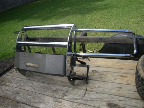1995 Ford Bronco - A winch bumper with a chrome brush guard is shown mounted on a trailer.